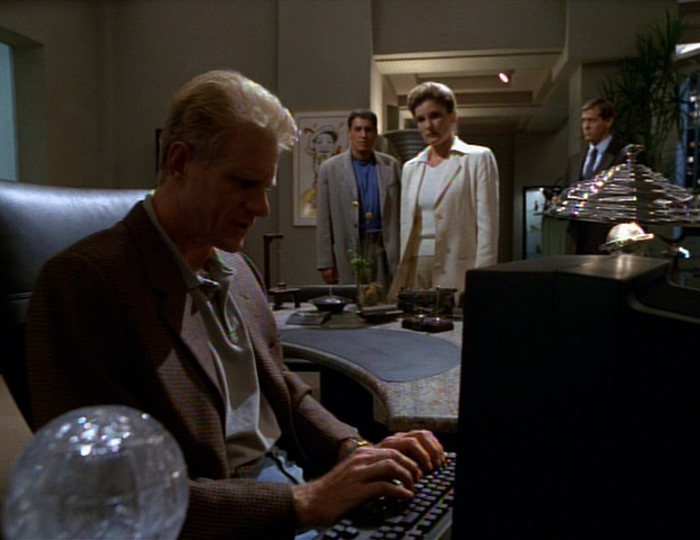 Starling, Chakotay, Janeway, and guard